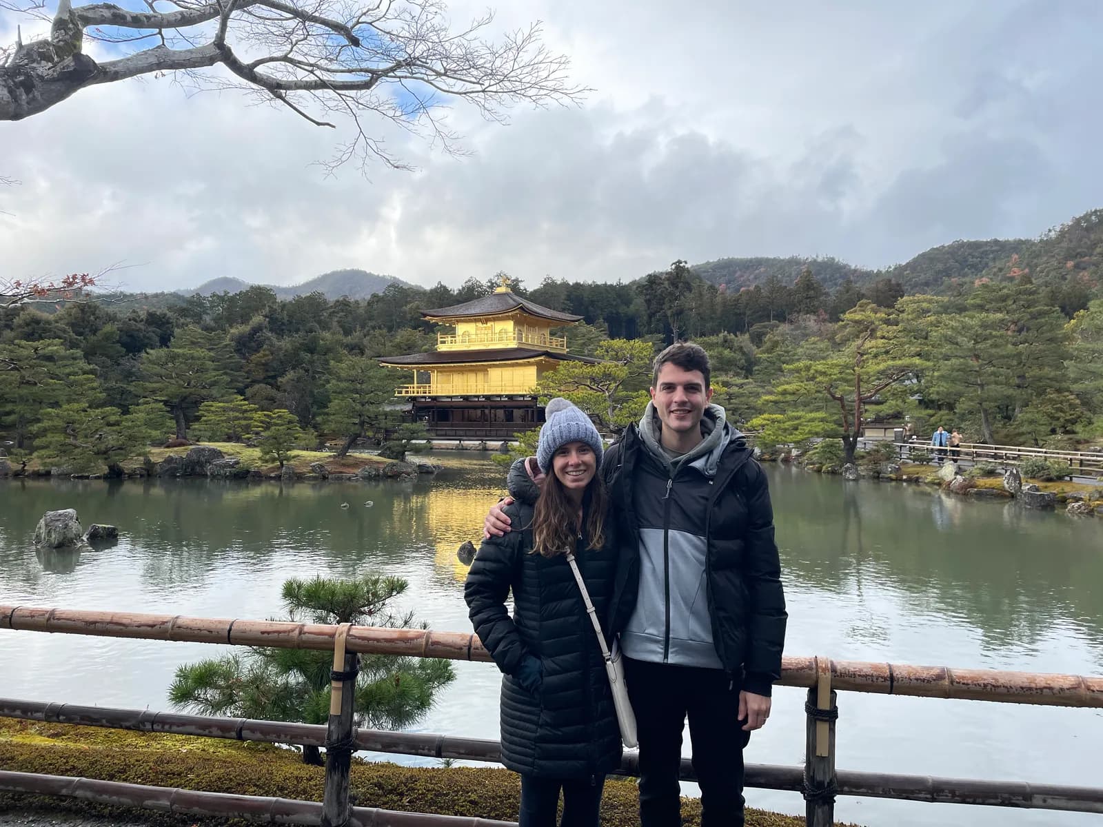 Nick and a companion by the pond in front of the Golden Pavilion
