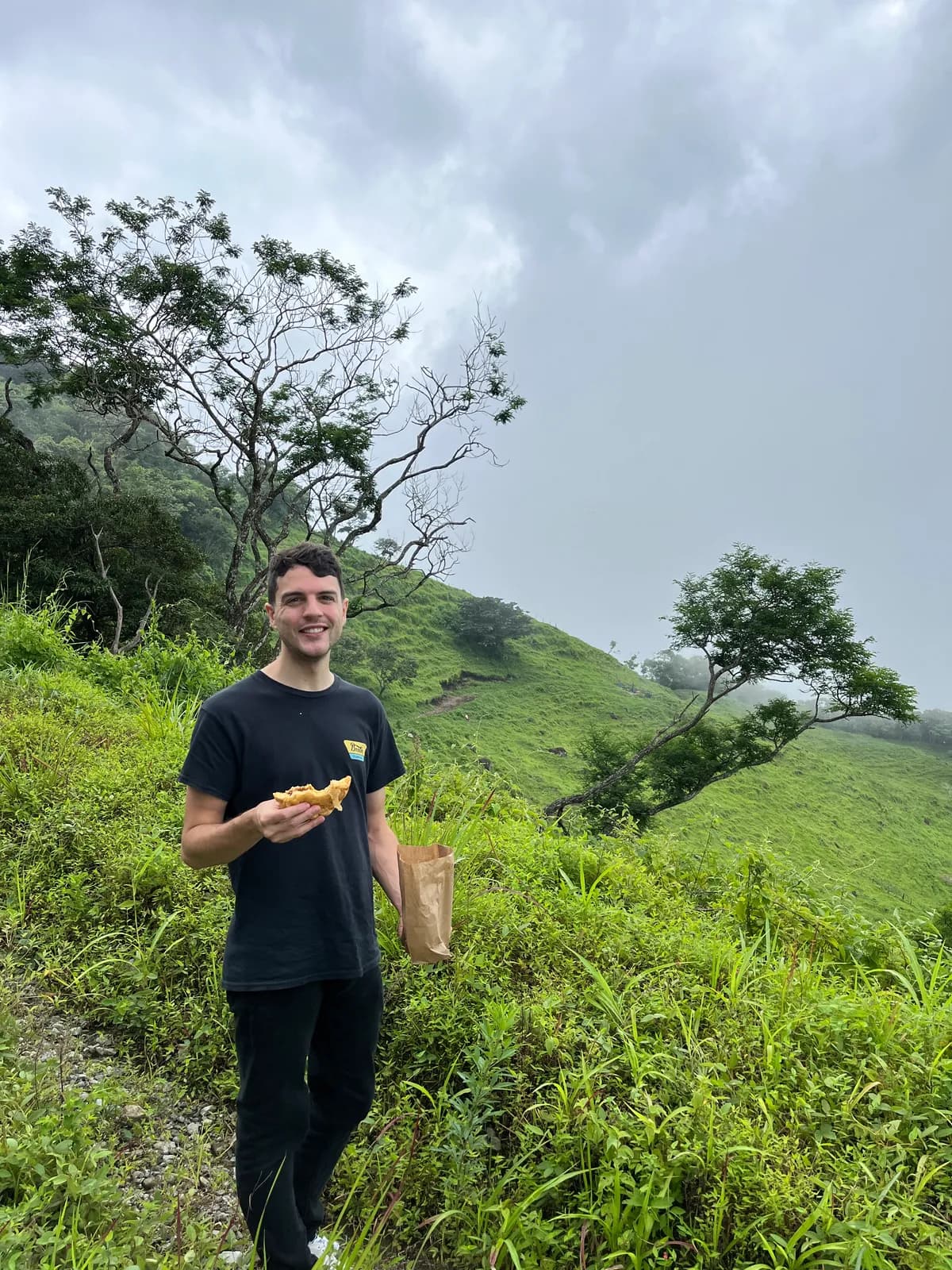 Nick on a green hillside in the Monteverde cloud forest, Costa Rica